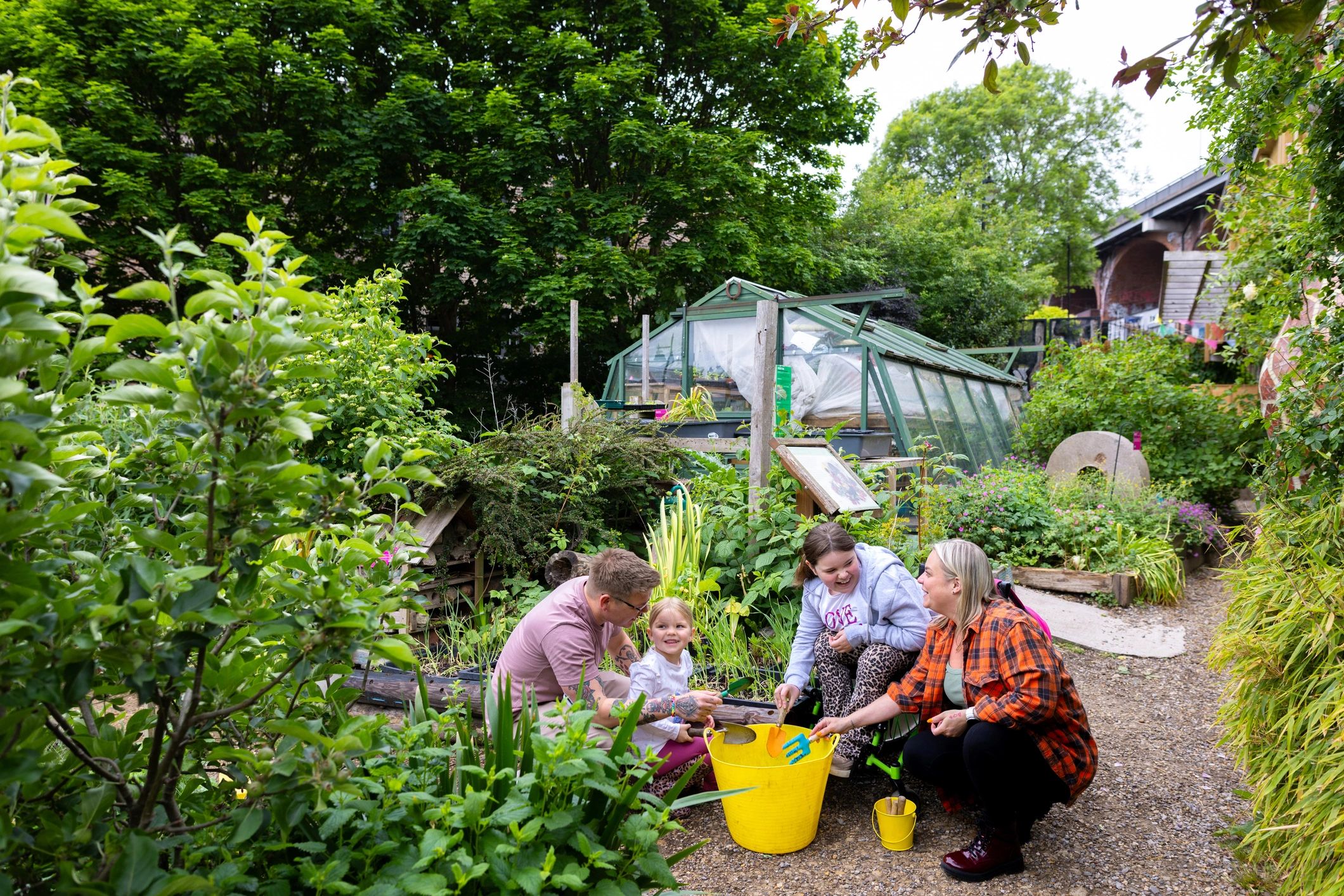 Community members gardening together outdoors